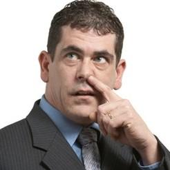Close-up of a person picking their nose, informal or humorous image