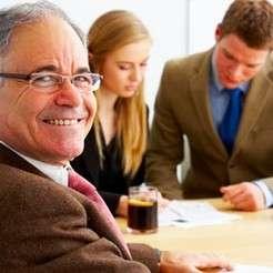 Older man smiling outdoors symbolizing retirement planning