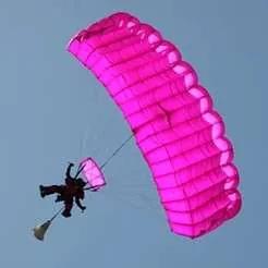 Skydiver mid-air with blue sky background