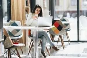 Student working on laptop debunking myths about online study